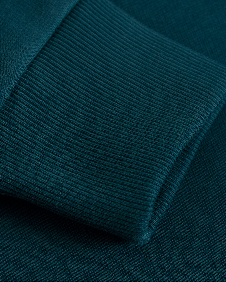 Hombres | Jerséis y prendas de punto | Peak Performance | Logo Crew Neck Sweatshirt Teal Extreme