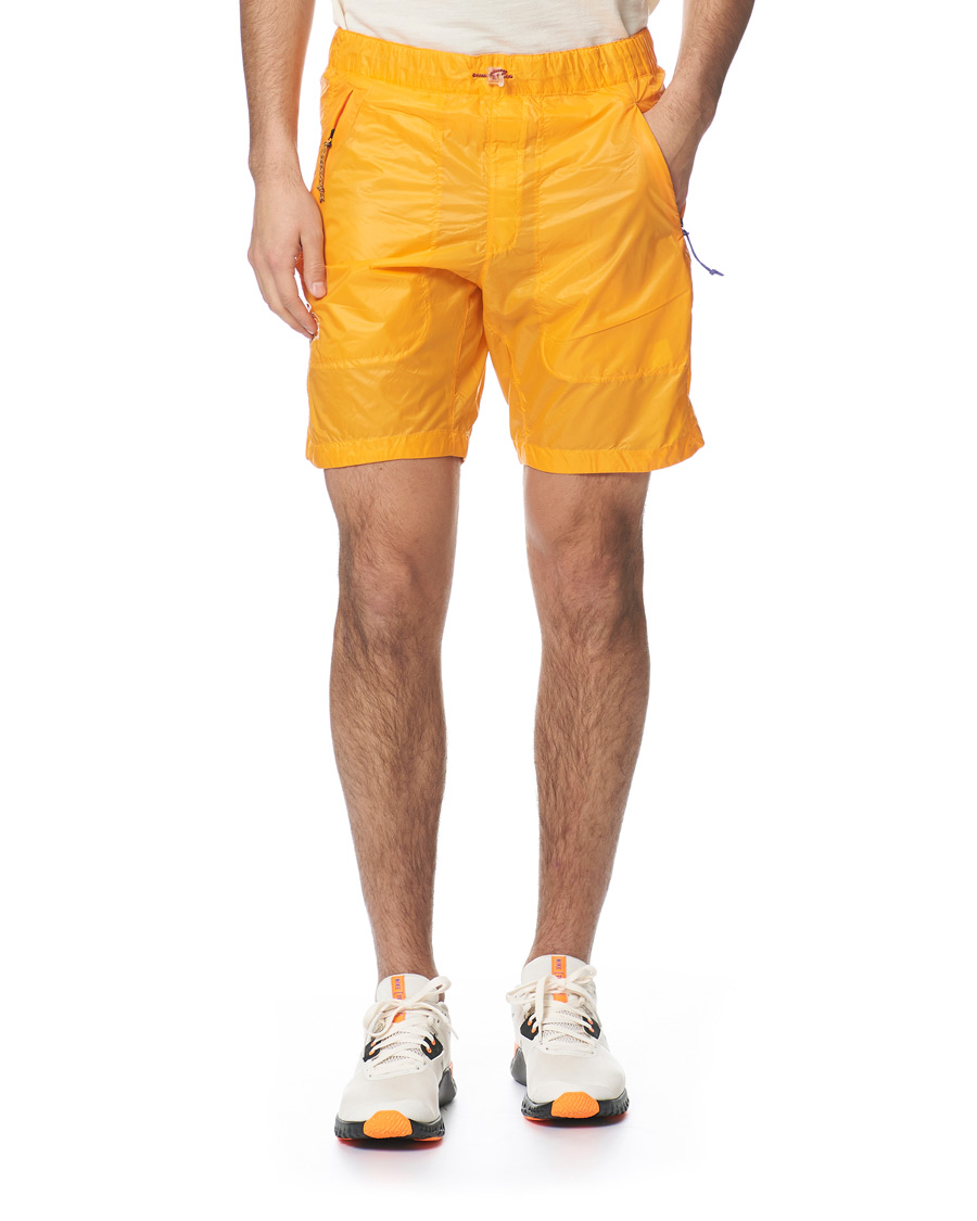 Hombres | Pantalones cortos | Peak Performance | Ben Gorham Windbreaker Shorts Orange