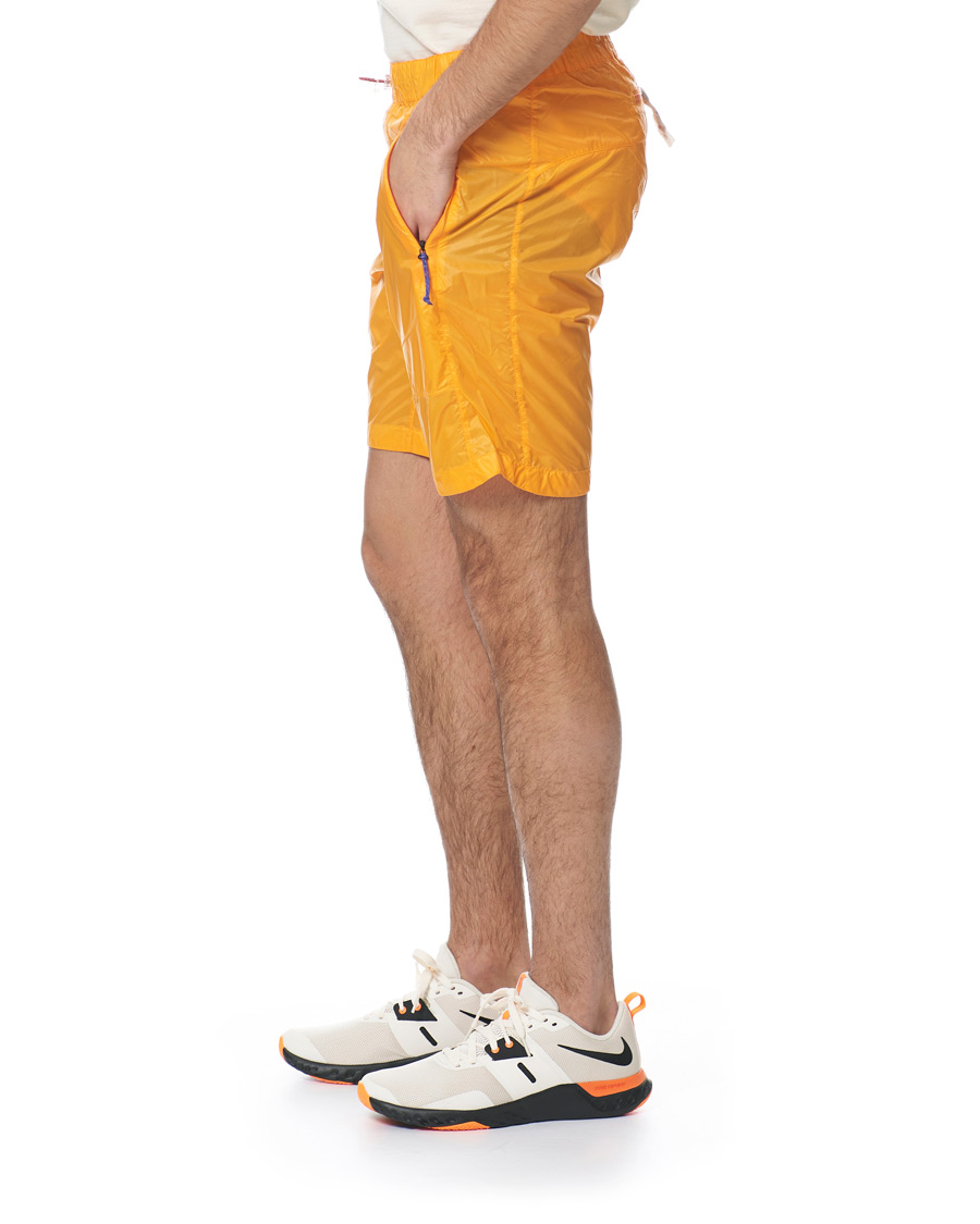 Hombres | Pantalones cortos | Peak Performance | Ben Gorham Windbreaker Shorts Orange