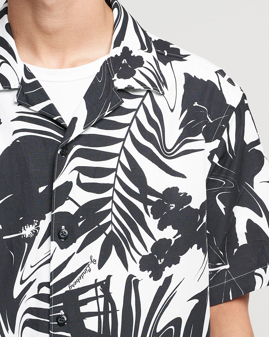 Hombres | Camisas | J.Lindeberg | Elio Hibiscus Print Short Sleeve Shirt White/Black