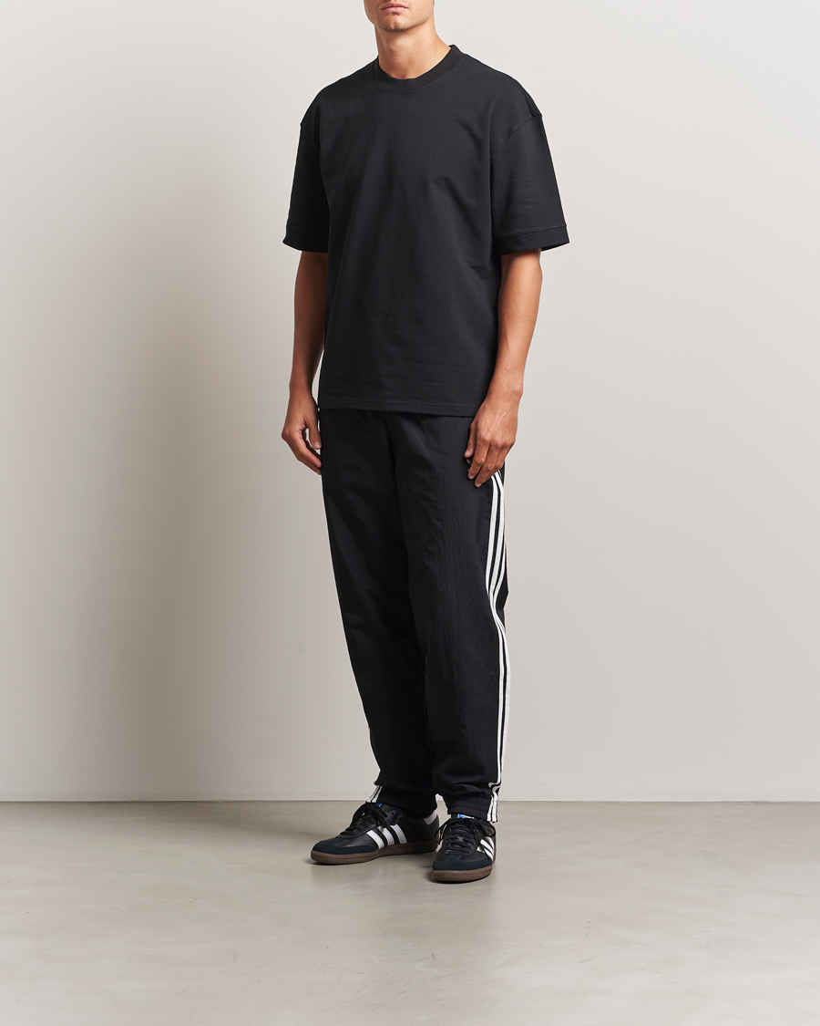 Hombres | Pantalones | adidas Originals | Firebird Track Pants Black/White