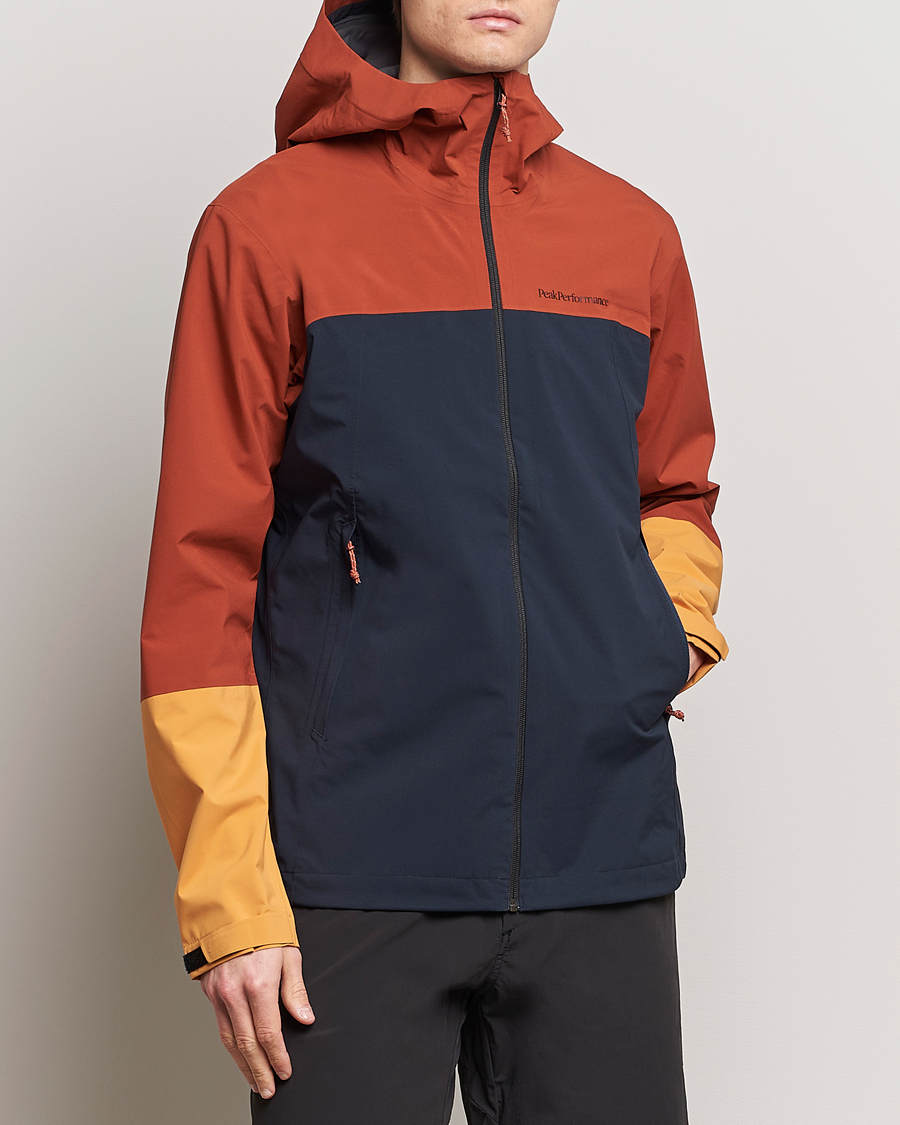 Hombres | Chaquetas impermeables | Peak Performance | Trail Hipe Hooded Jacket Spiced/Salute Navy/Desert