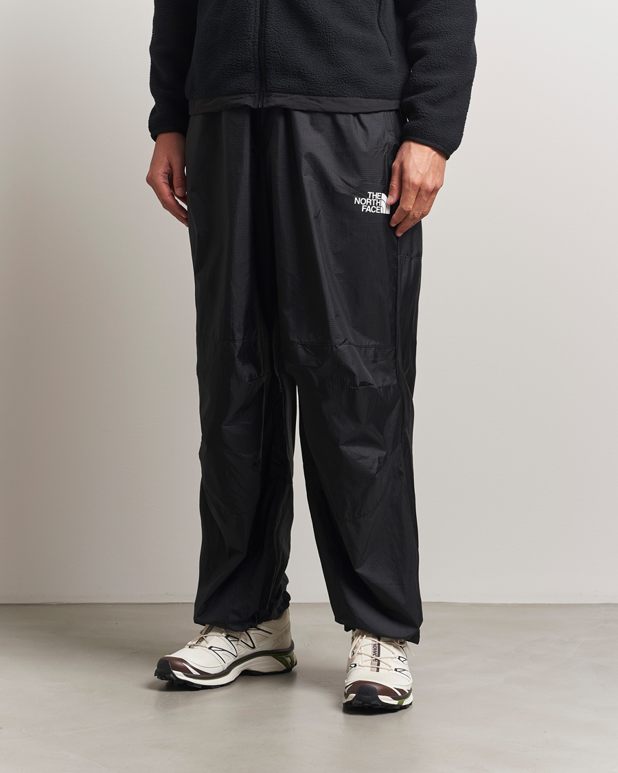 Hombres | Pantalones | The North Face | NSE Wind Track Pants Black