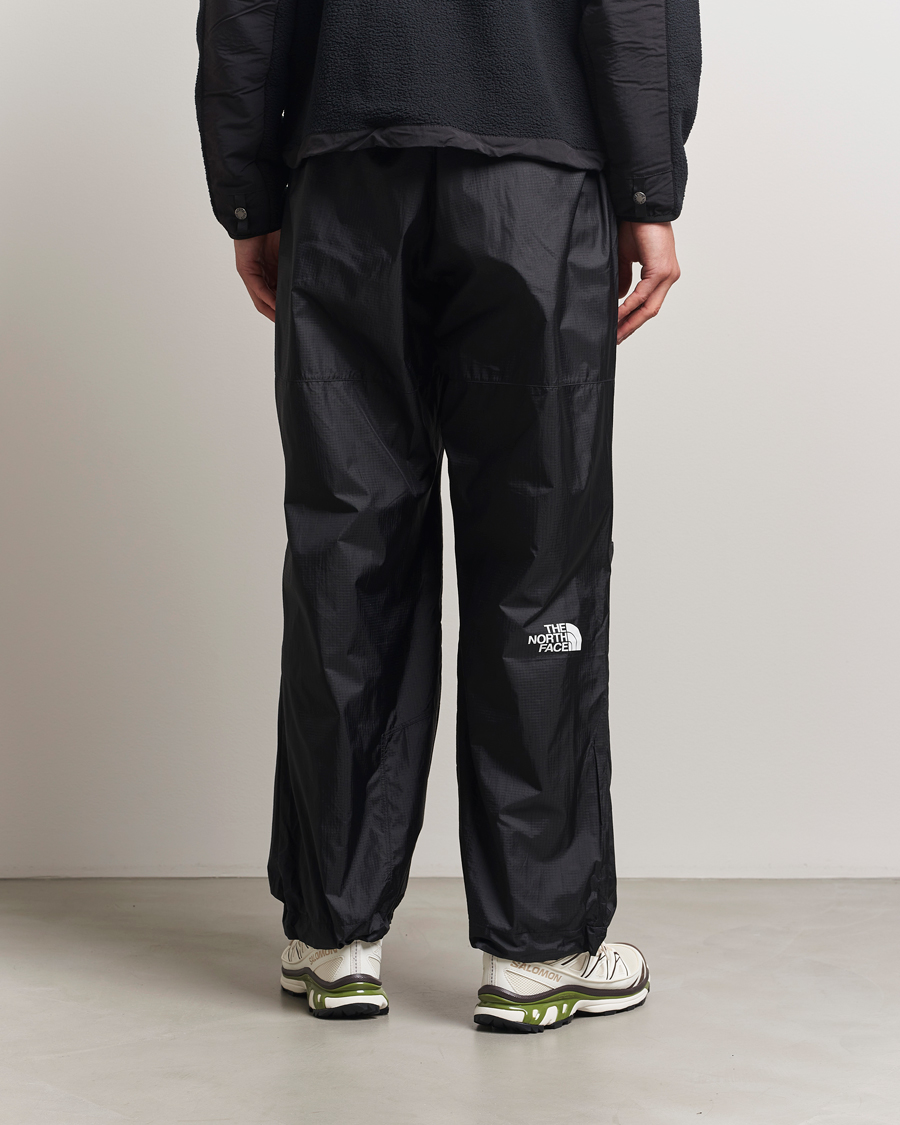Hombres | Pantalones | The North Face | NSE Wind Track Pants Black