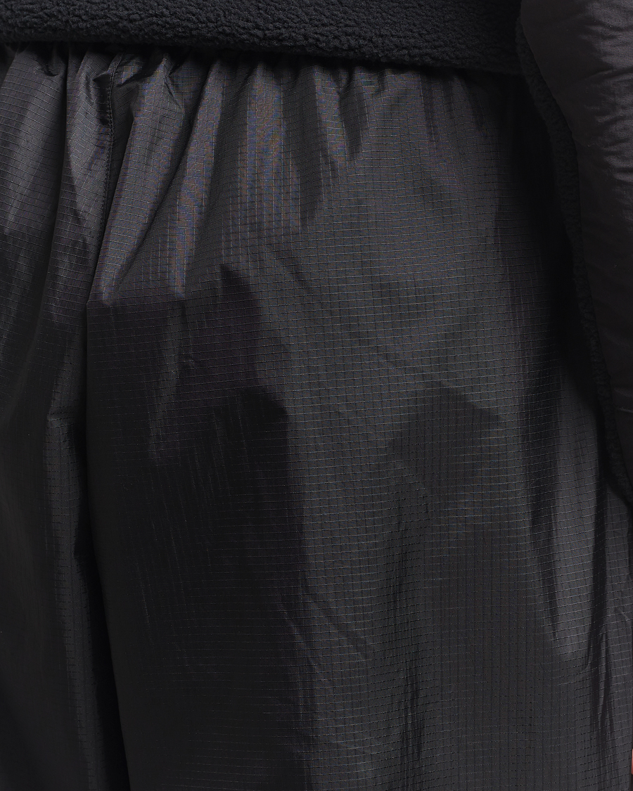 Hombres | Pantalones | The North Face | NSE Wind Track Pants Black